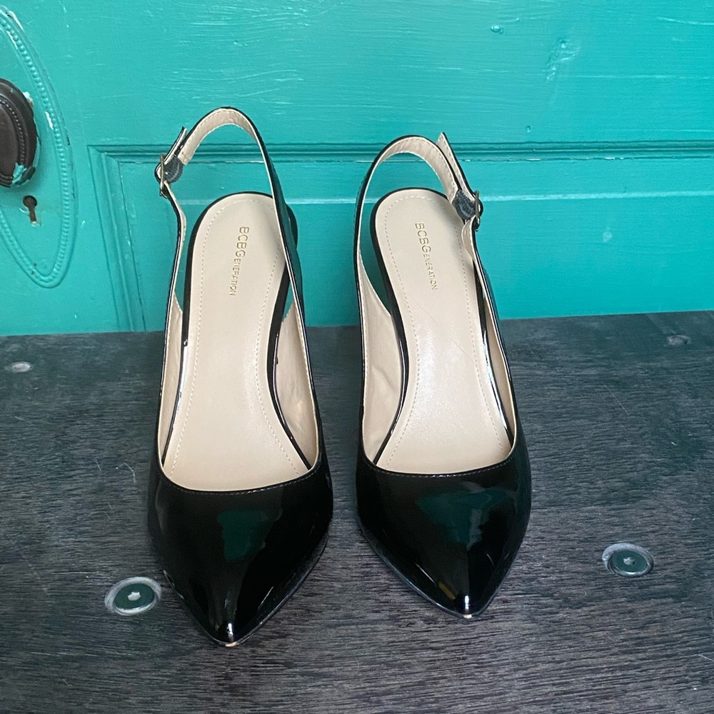 Black patent leather, sling back heels.